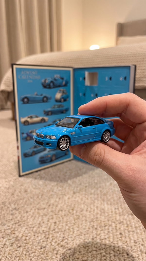 Light-blue early-2000s coupe die-cast